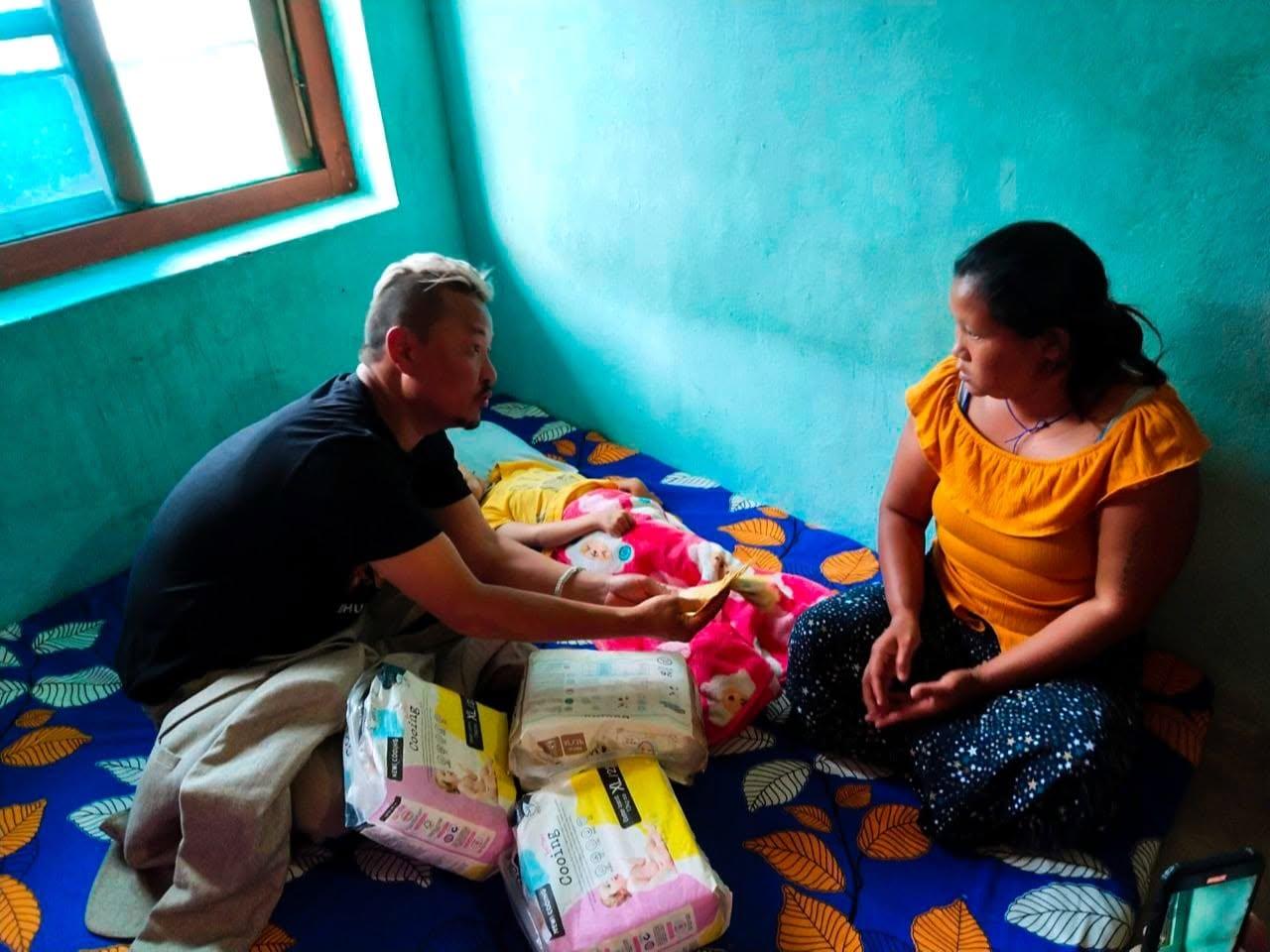 Karma Kelvin delivering essential supplies to a family