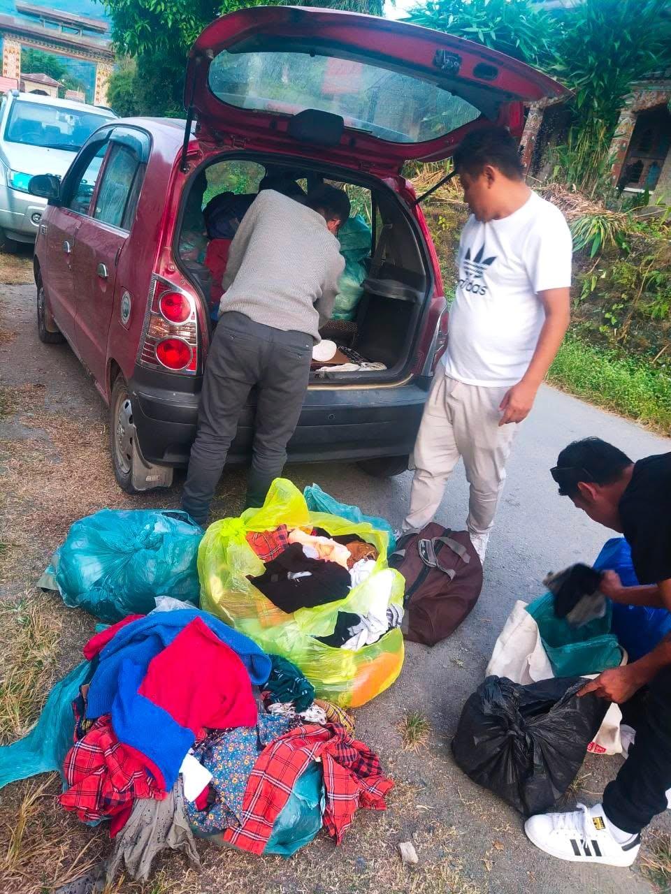 Volunteers unloading donated clothing